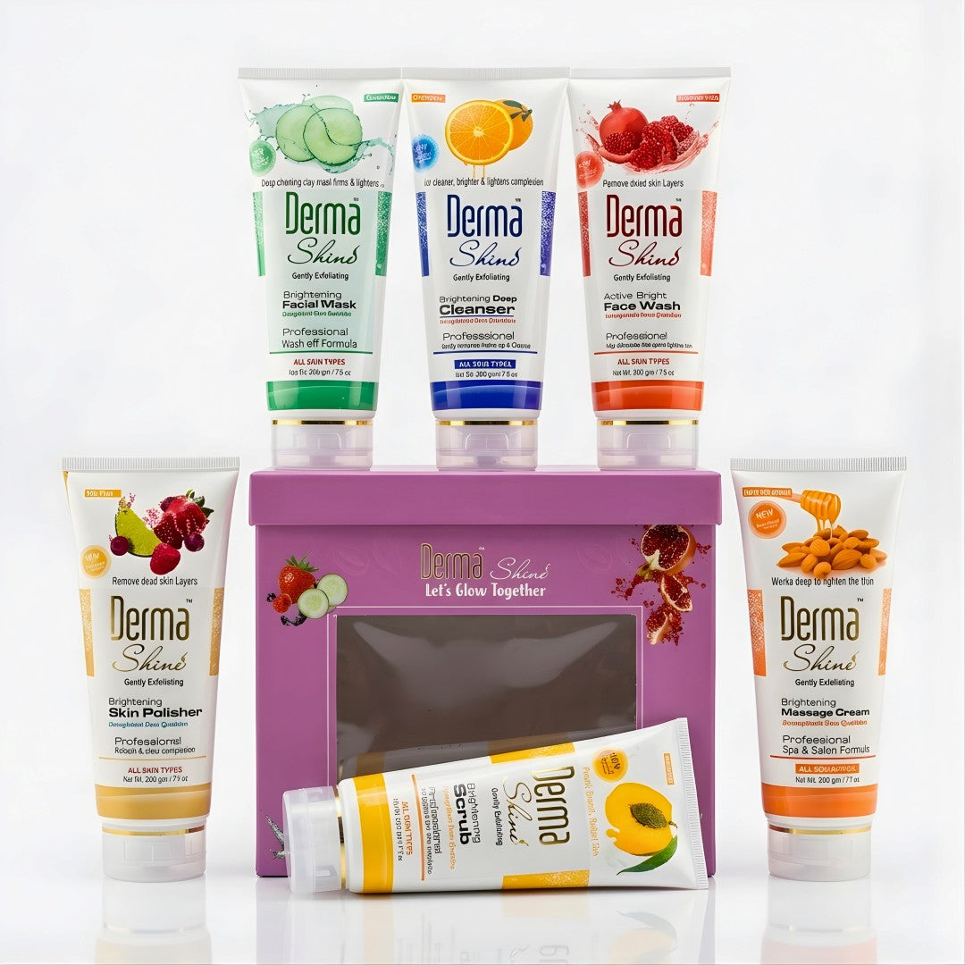 A Derma Shield skincare gift set featuring six tubes of facial care products arranged around a purple gift box on a white background. The set includes facial mask, cleanser, face wash, skin polisher, moisturizer, and massage cream in assorted fruit and herb scents.